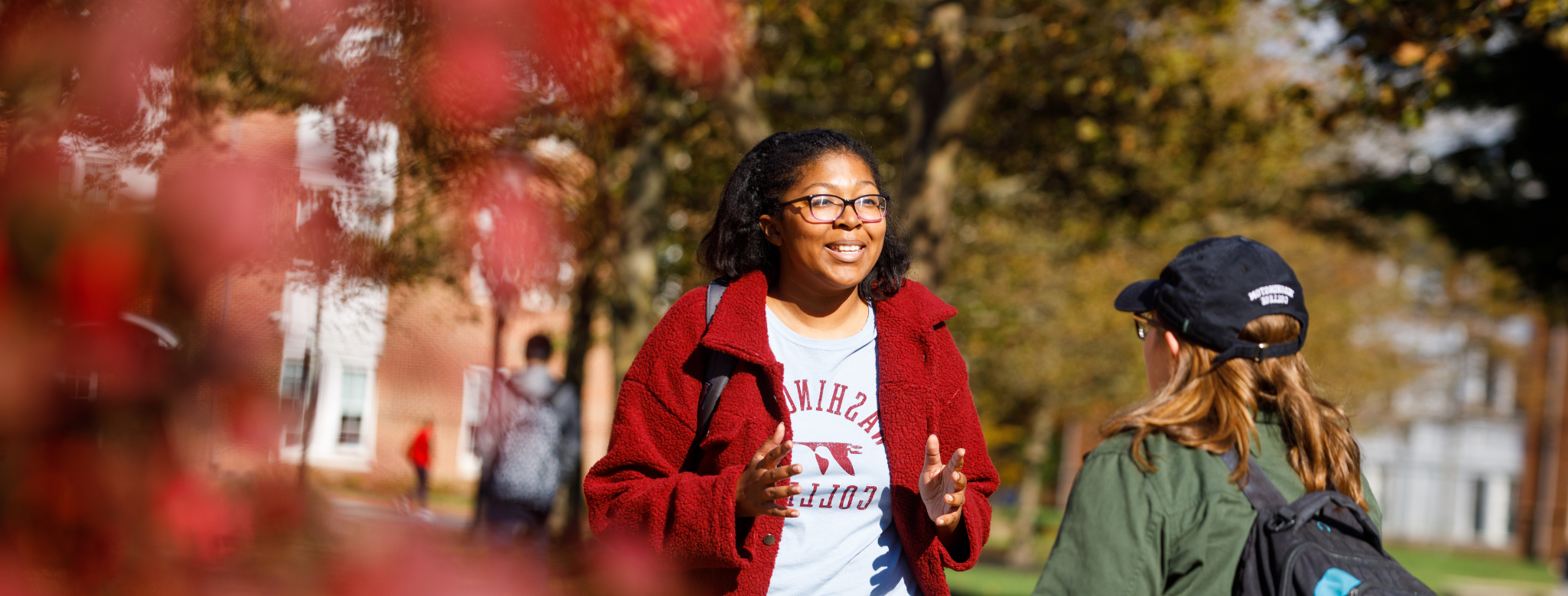 Students chatting by the baseball stadium